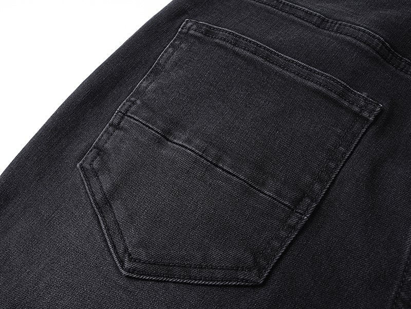 AMIRI Distressed Slim Tapered Jeans — detail