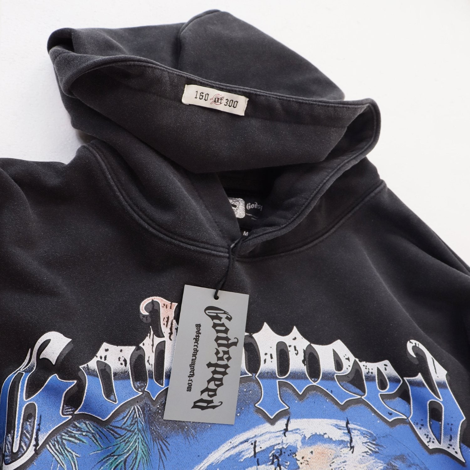 Godspeed Earth Tech Graphic Hoodie — hang_tag