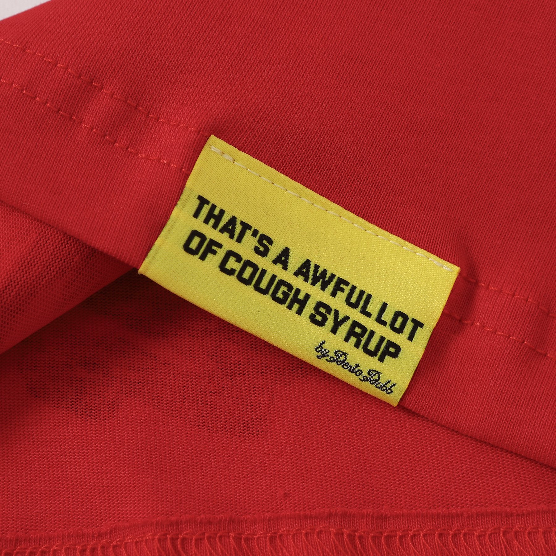 THAT'S A AWFUL LOT OF COUGH SYRUP Bottle Graphic T-Shirt — hang_tag