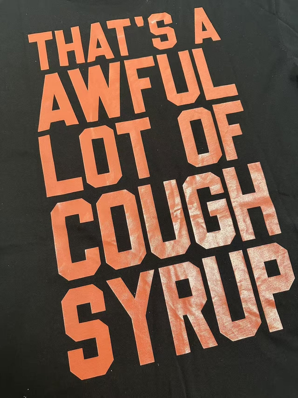 THAT'S A AWFUL LOT OF COUGH SYRUP Star Graphic Short-Sleeve T-Shirt — detail