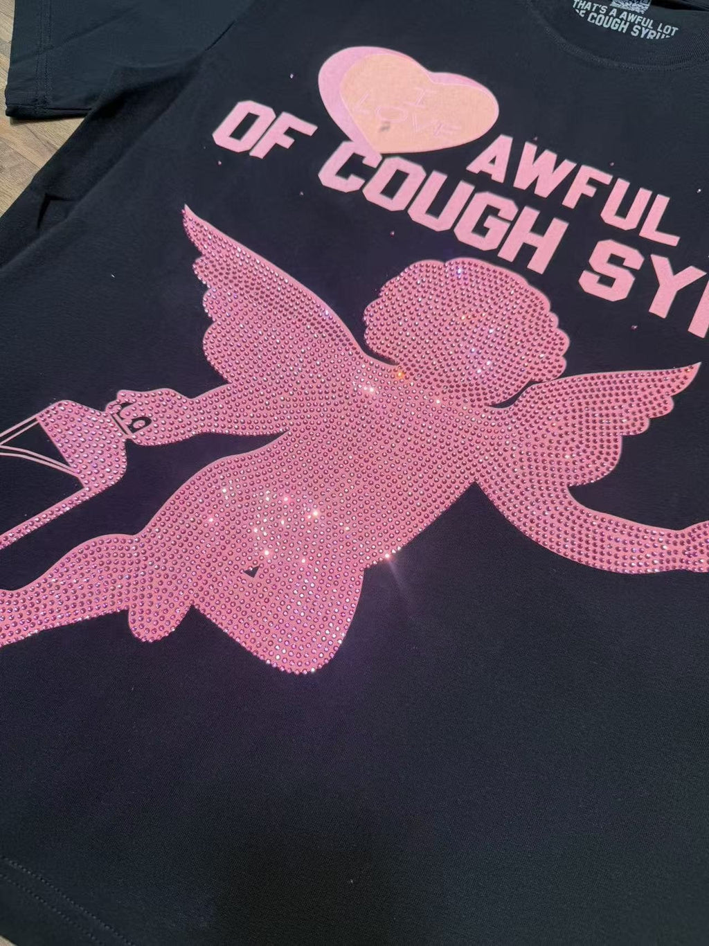 THAT'S A AWFUL LOT OF COUGH SYRUP Heart Cupid Graphic T-Shirt — fabric_closeup
