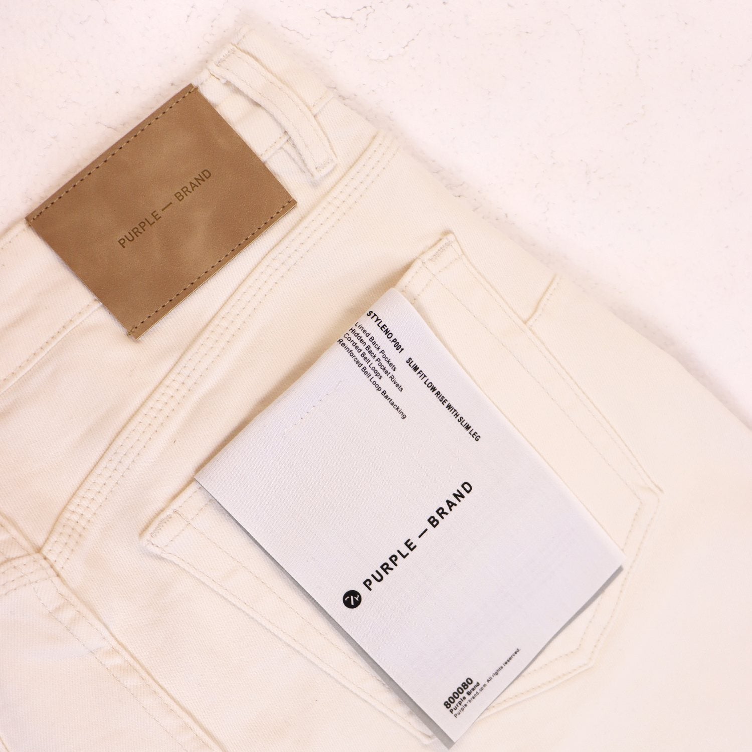Purple Brand Distressed Graphic Jeans — hang_tag