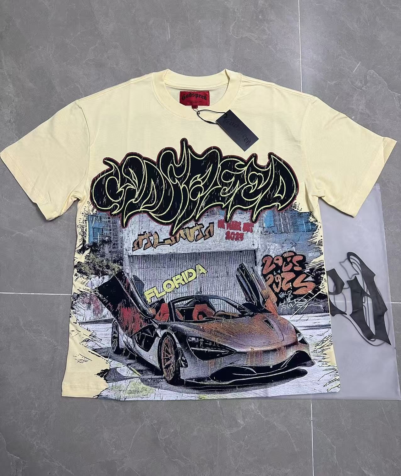 Godspeed Out of Many One Car Graphic T-Shirt — context