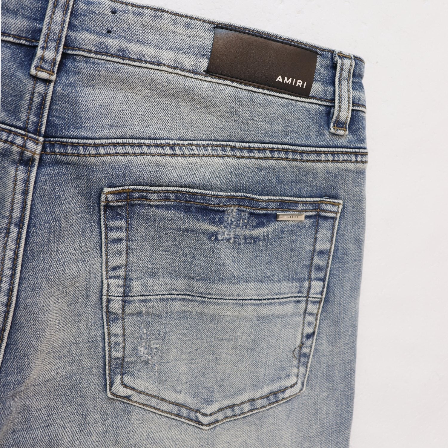 AMIRI Sinners Distressed Skinny Jeans — detail