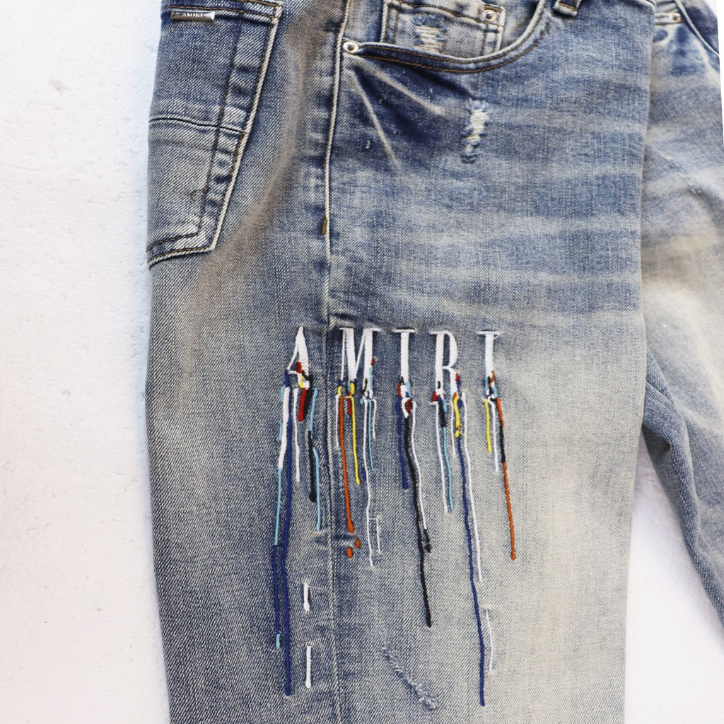 AMIRI Sinners Distressed Skinny Jeans — front