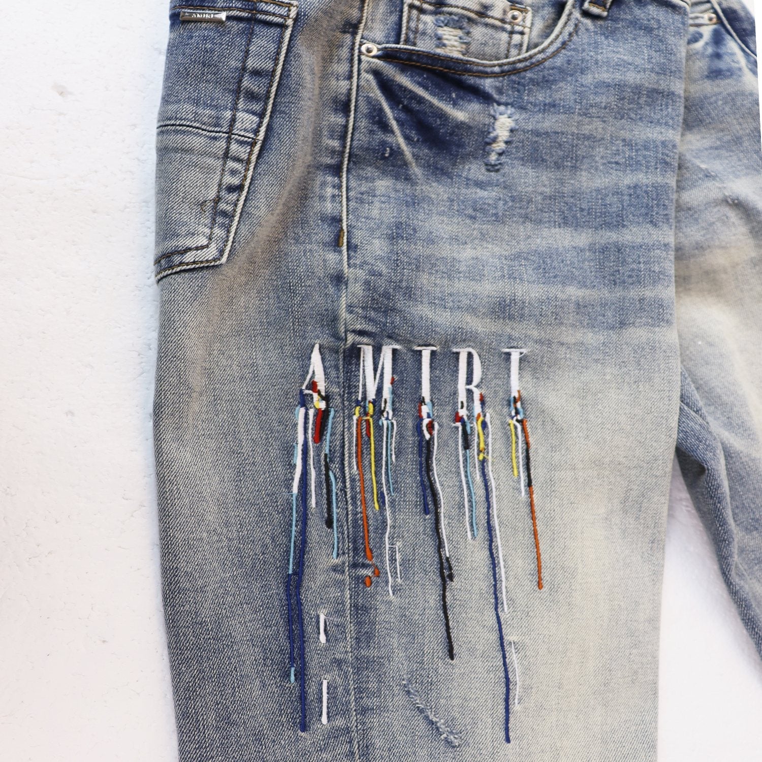 AMIRI Sinners Distressed Skinny Jeans — front