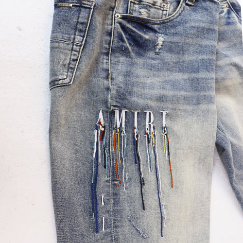 AMIRI Sinners Distressed Skinny Jeans — front