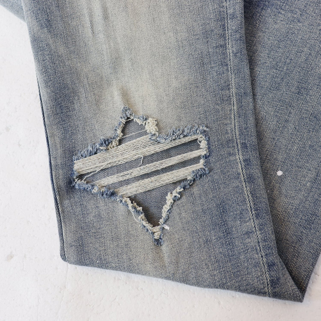 AMIRI Sinners Distressed Skinny Jeans — detail