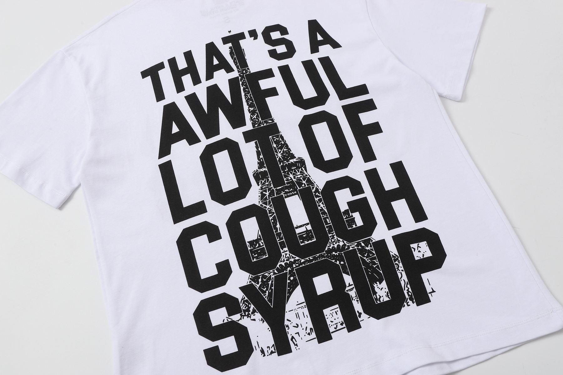 THAT'S A AWFUL LOT OF COUGH SYRUP Eiffel Tower Graphic T-Shirt — detail