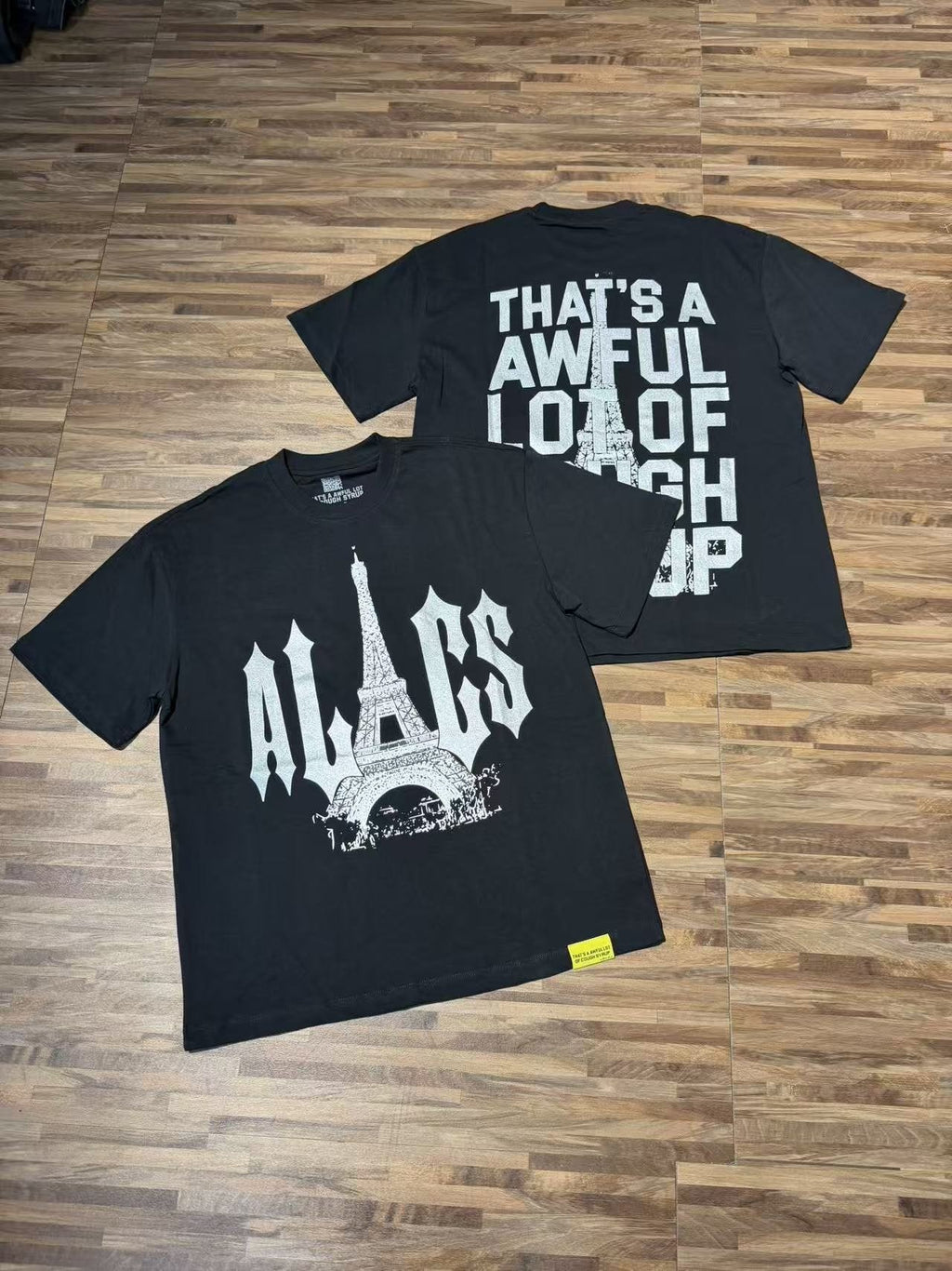 THAT'S A AWFUL LOT OF COUGH SYRUP Eiffel Tower Graphic T-Shirt — context