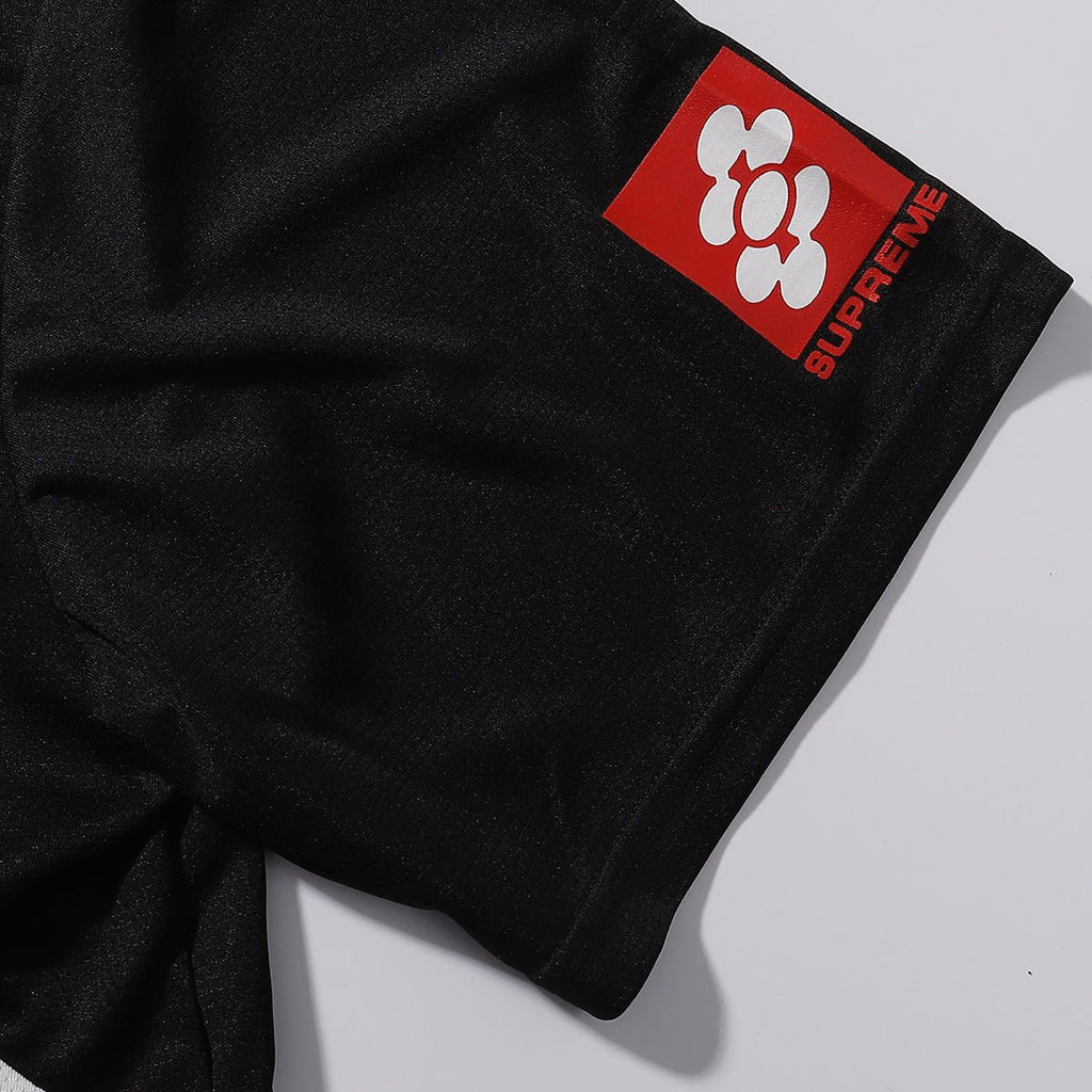 Supreme Black Soccer-Inspired Jersey Graphic T-Shirt — fabric_closeup