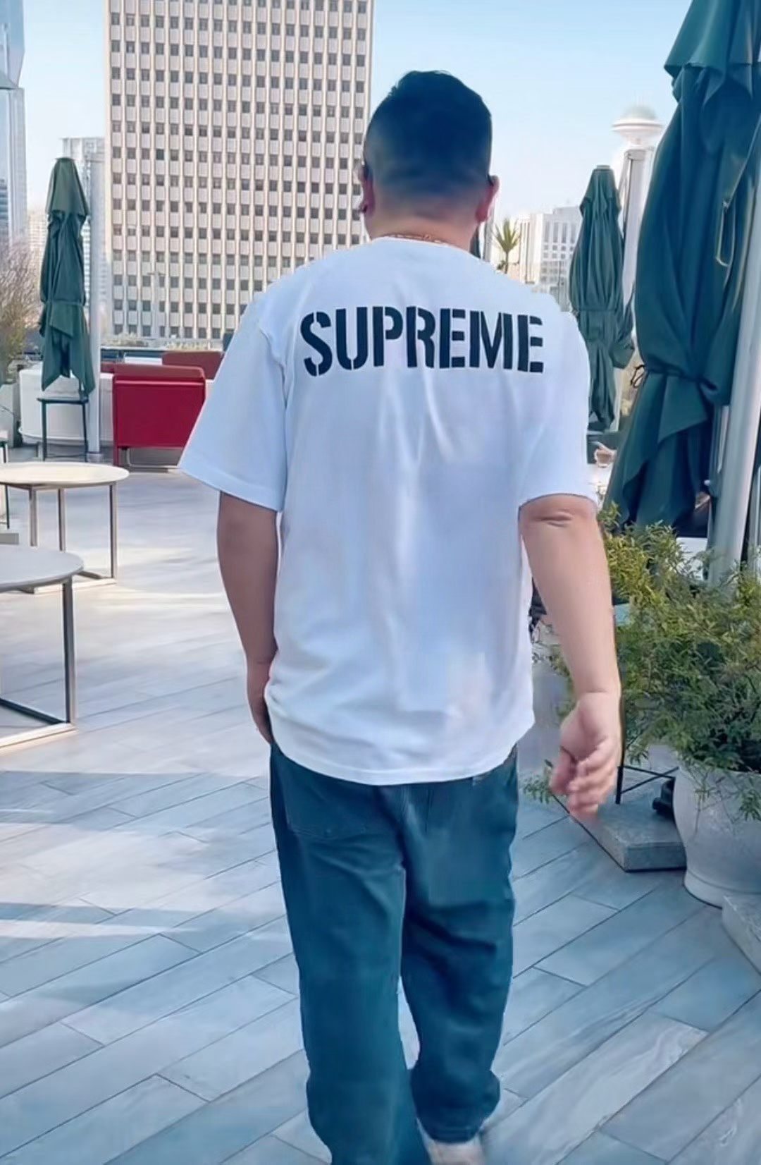 Supreme World Famous Short-Sleeve Graphic T-Shirt — model