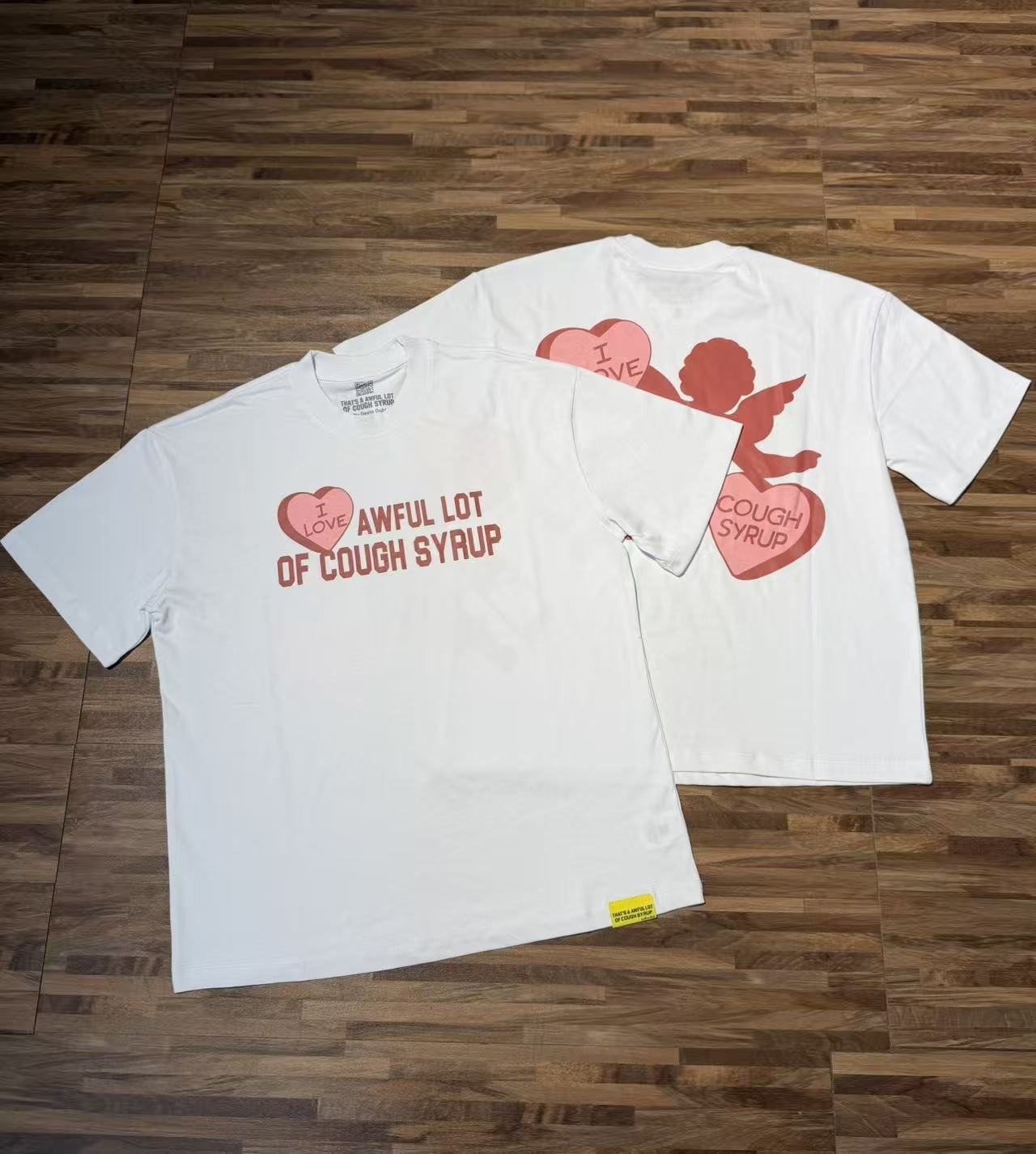 THAT'S A AWFUL LOT OF COUGH SYRUP Cupid Heart Graphic T-Shirt — context