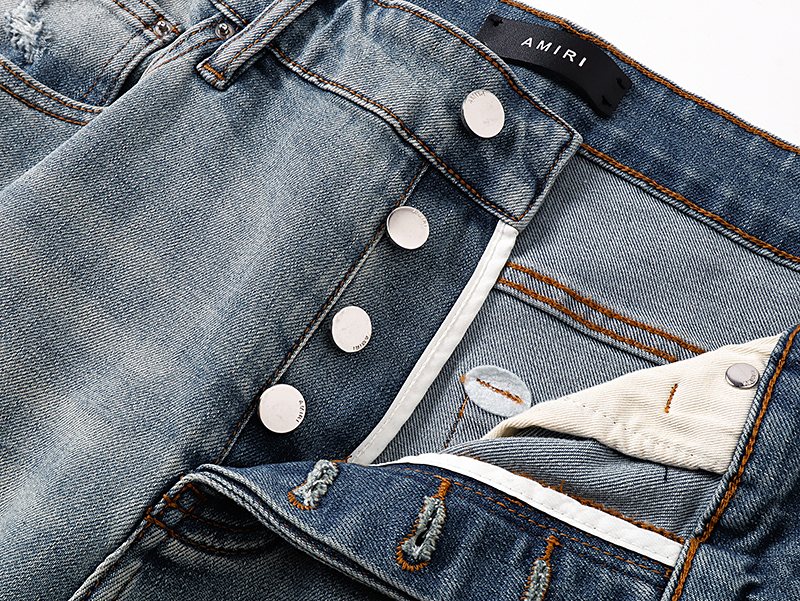 AMIRI Light Blue Distressed Monogram Denim Shorts — detail