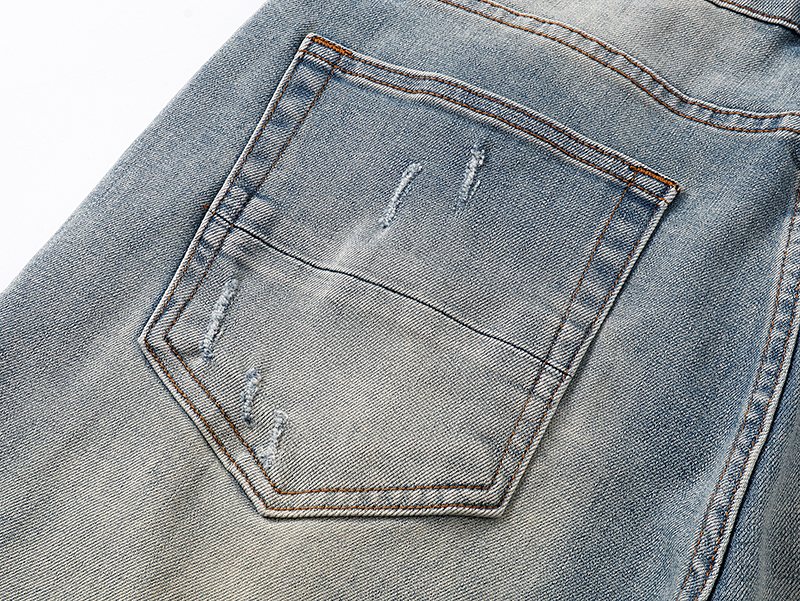 AMIRI Light Blue Distressed Monogram Denim Shorts — detail