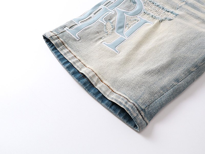 AMIRI Light Blue Monogram Denim Shorts — detail