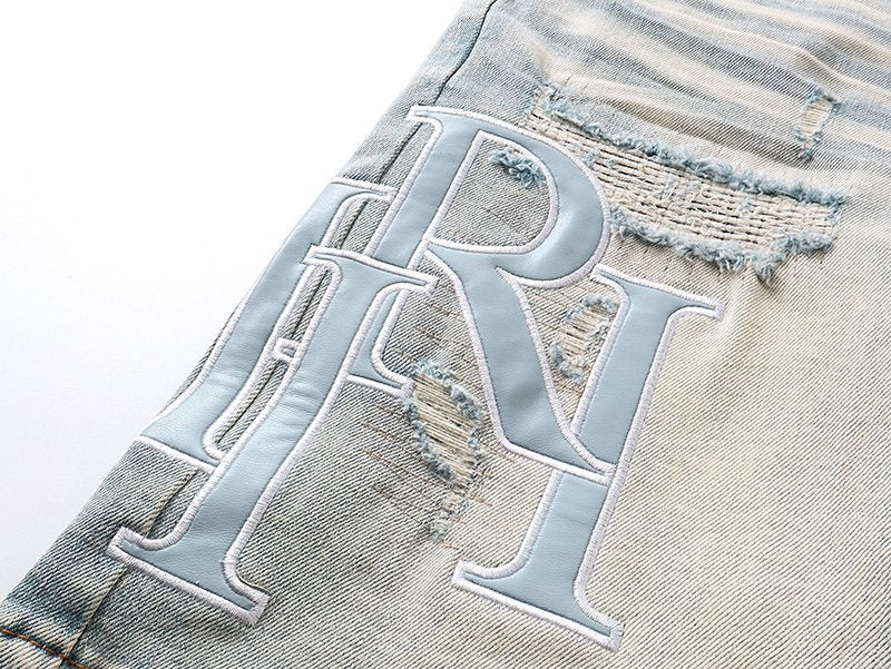 AMIRI Light Blue Monogram Denim Shorts — detail