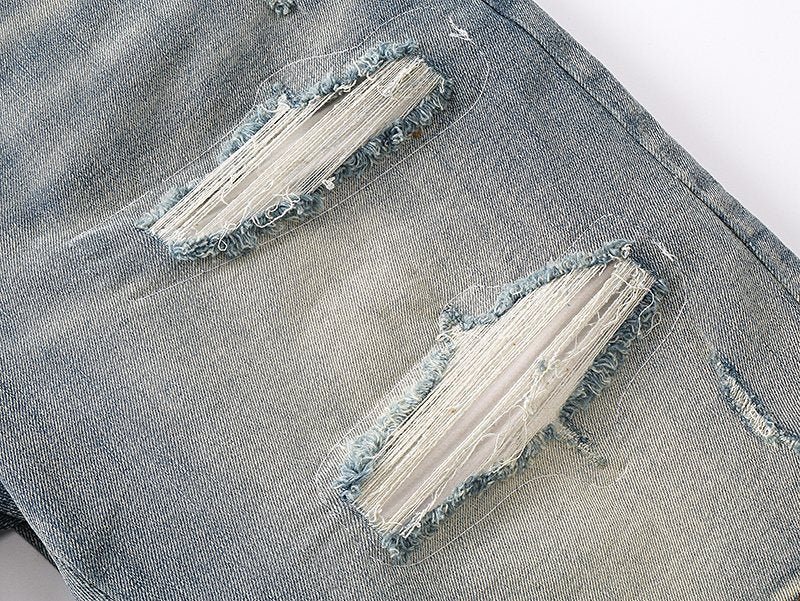 AMIRI Light Blue Distressed Denim Shorts — detail