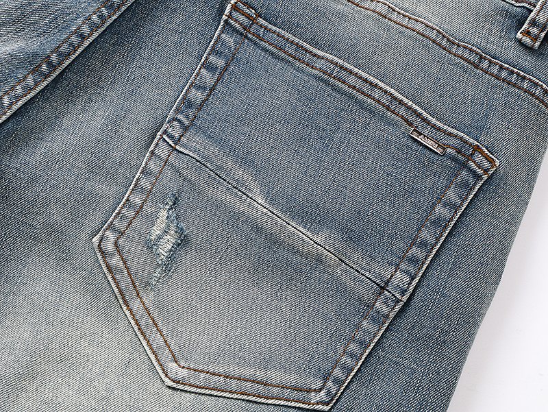 AMIRI Light Blue Distressed Denim Shorts — detail