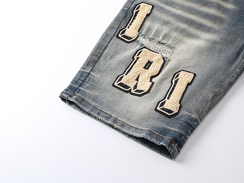 AMIRI Light Blue Letter Patch Denim Shorts — detail