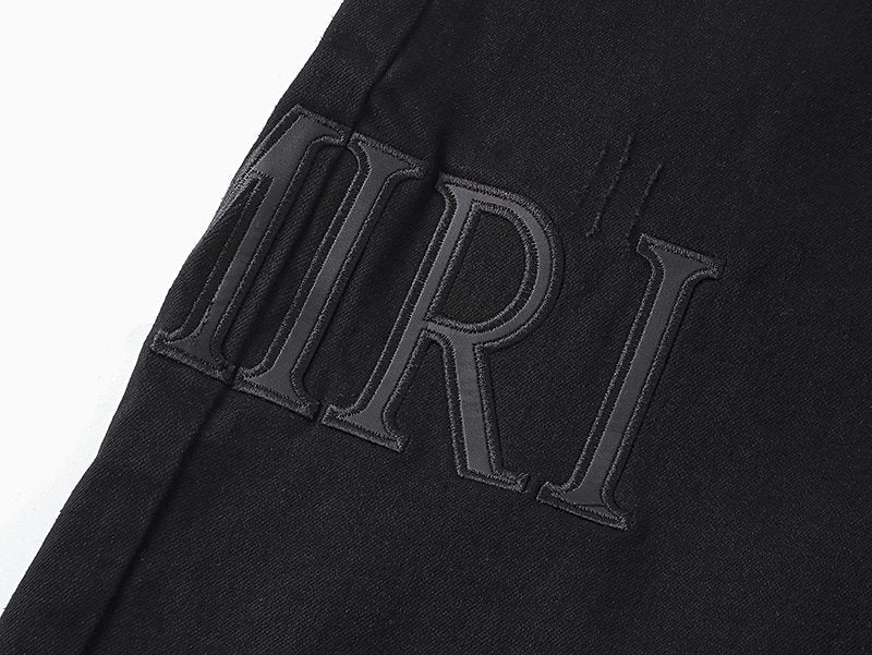 AMIRI Distressed Black Denim Shorts — detail