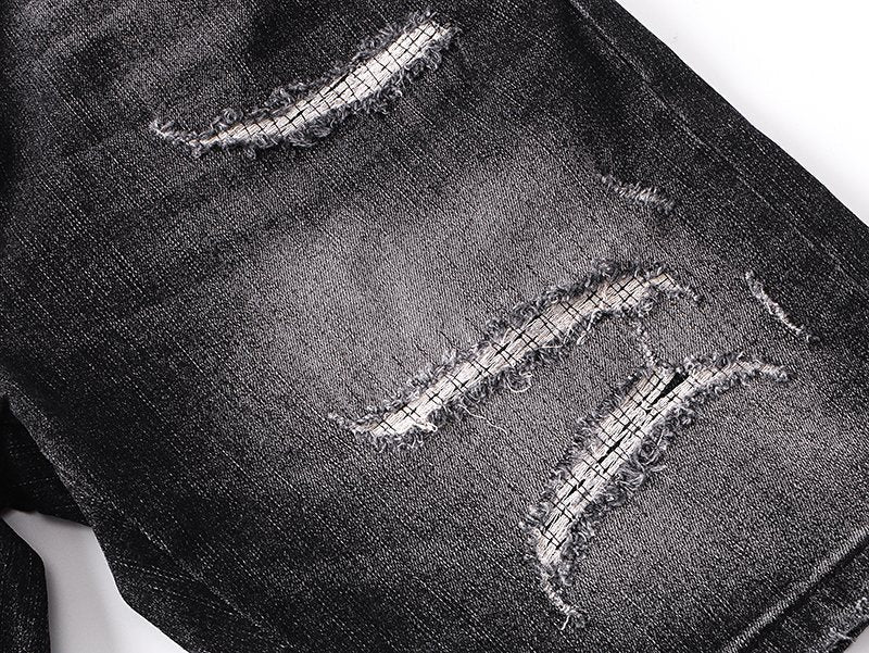 AMIRI Washed Black Embroidered Denim Shorts — detail