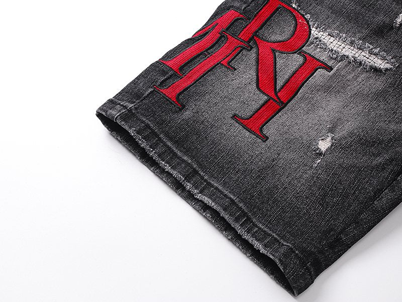 AMIRI Washed Black Embroidered Denim Shorts — detail