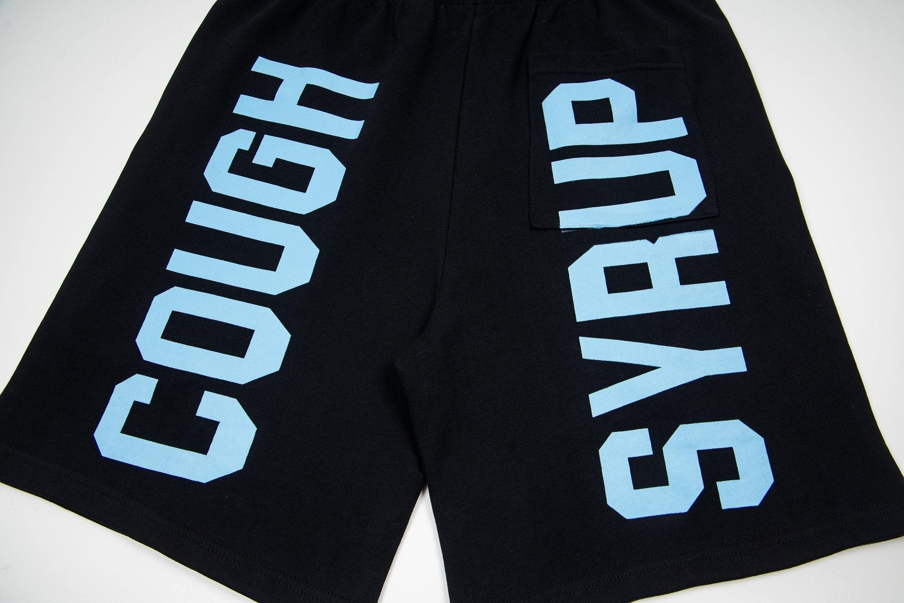 THAT'S A AWFUL LOT OF COUGH SYRUP Black Graphic Shorts — detail