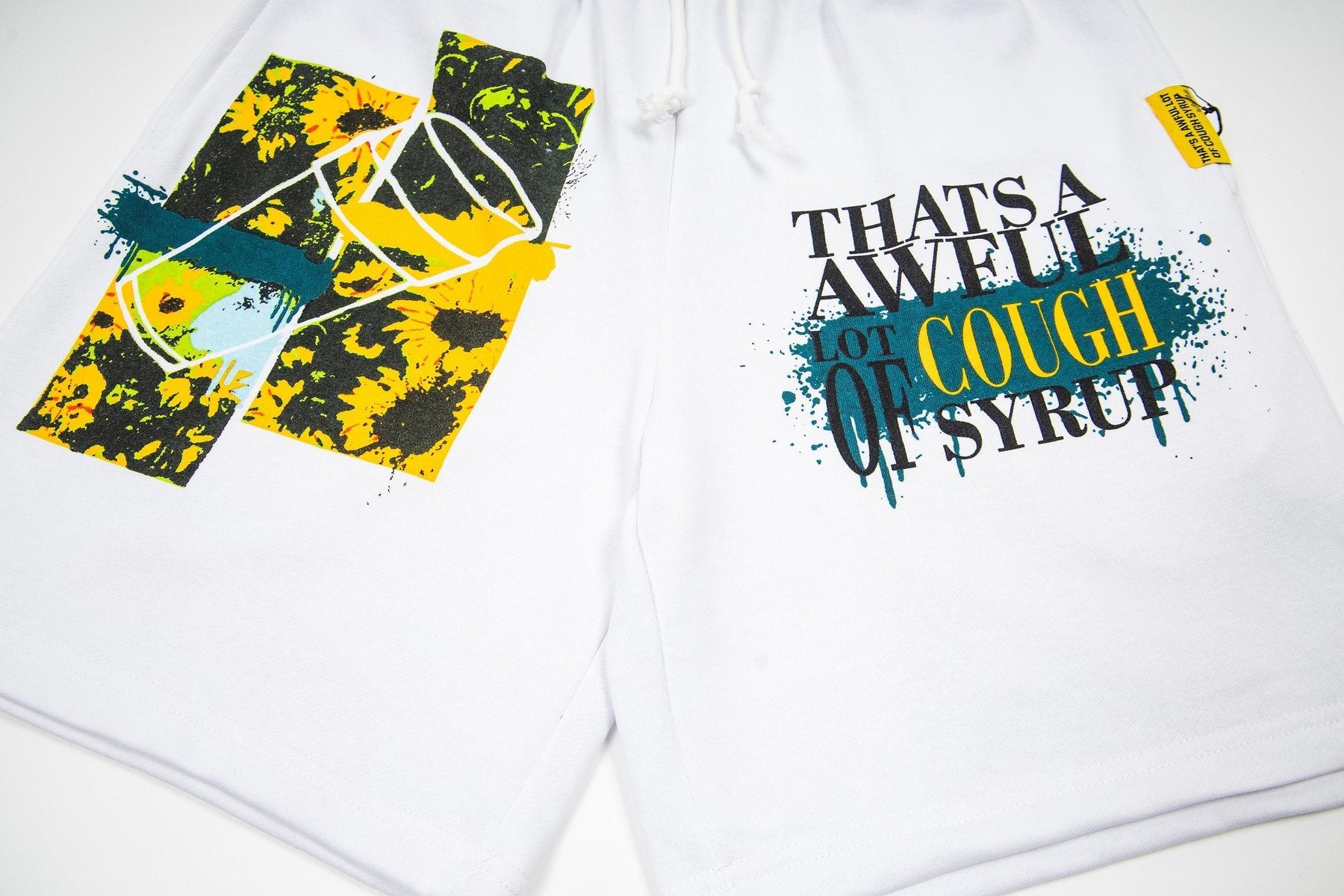 THAT'S A AWFUL LOT OF COUGH SYRUP Graphic Drawstring Shorts — detail