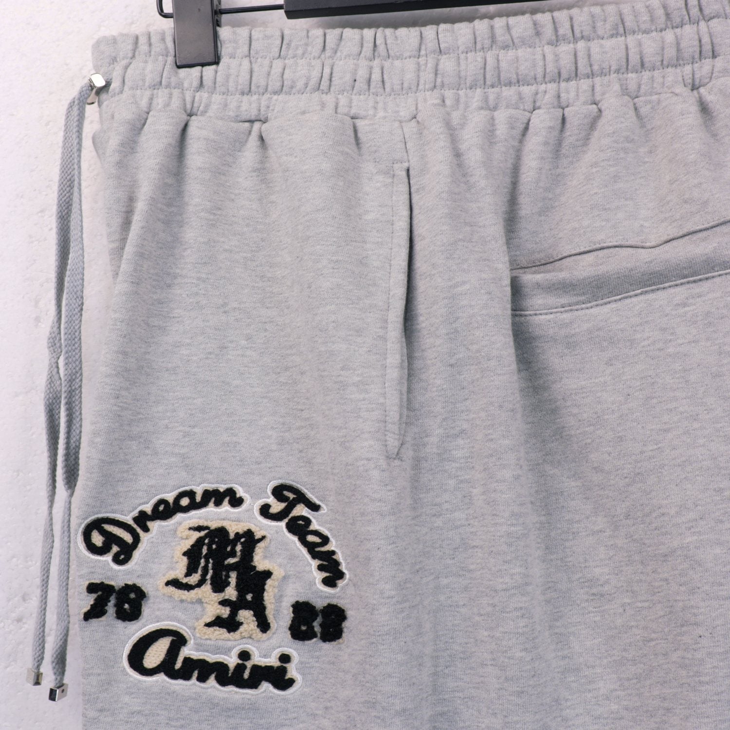 AMIRI Embroidered Leg Graphic Sweatpants — front