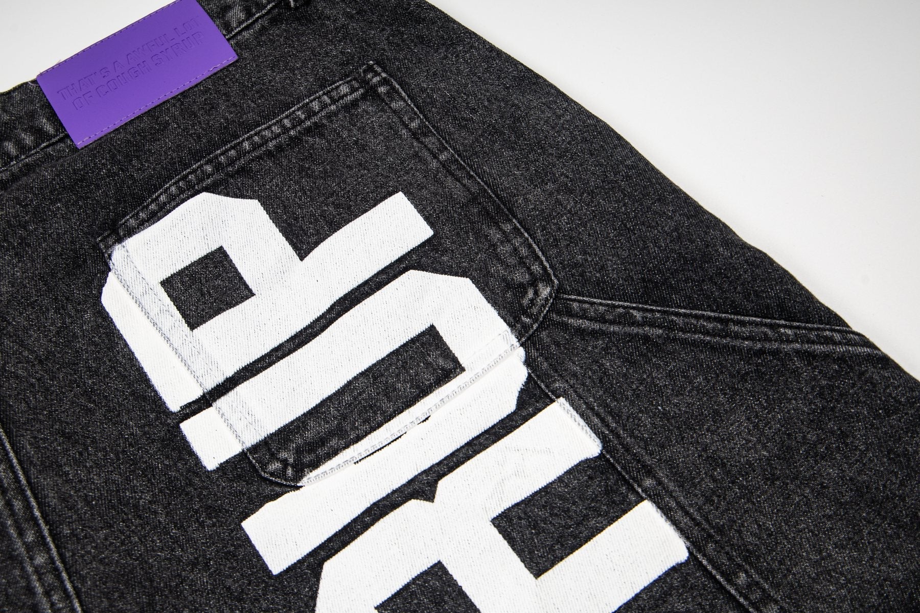 THAT'S A AWFUL LOT OF COUGH SYRUP Washed Denim Graphic Shorts — detail