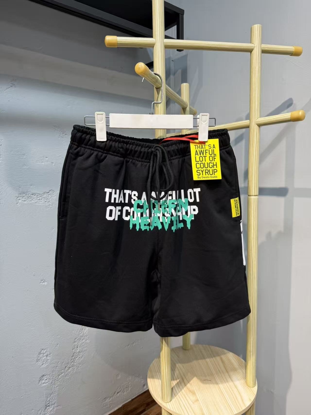 THAT'S A AWFUL LOT OF COUGH SYRUP Drawstring Graphic Shorts — context
