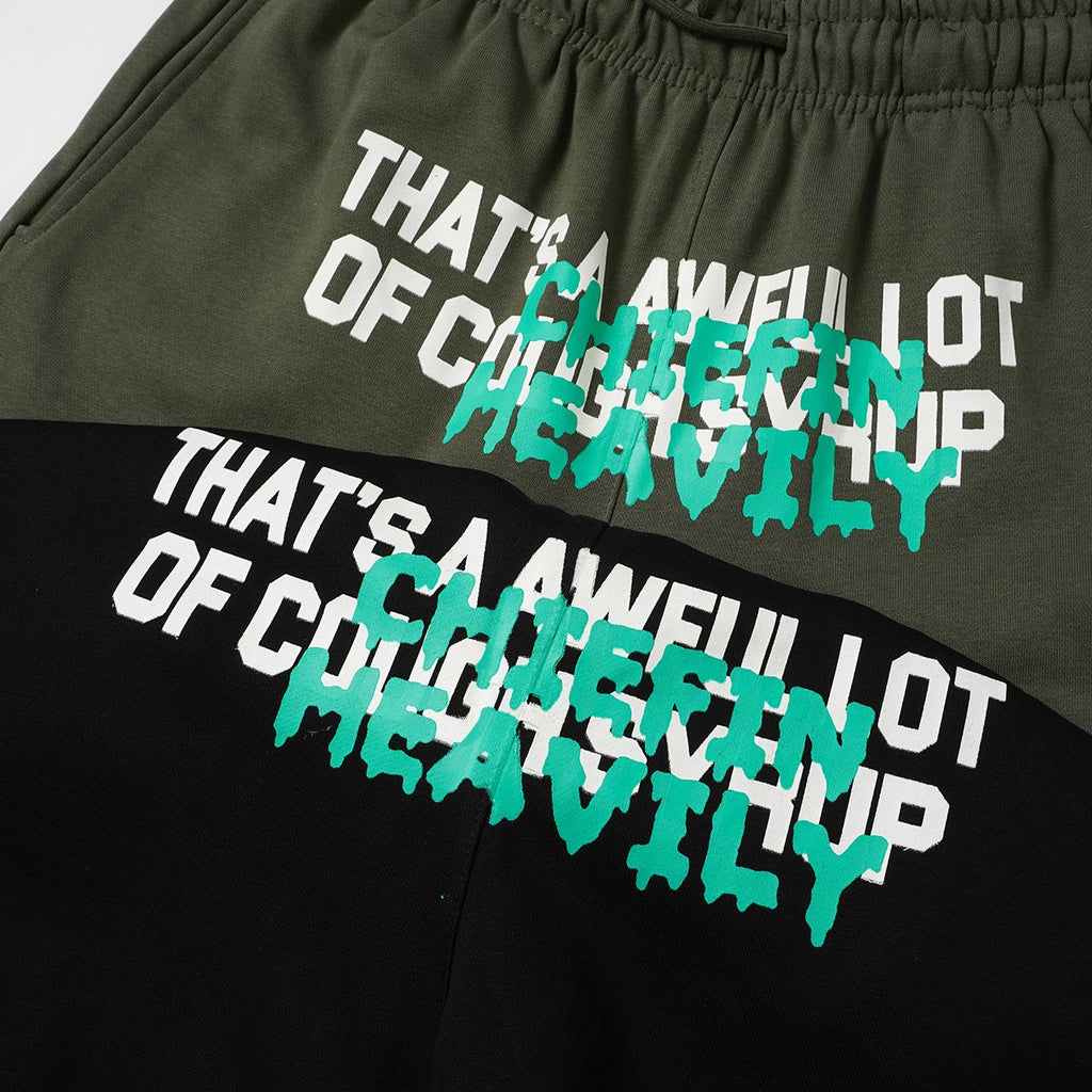 THAT'S A AWFUL LOT OF COUGH SYRUP Drawstring Graphic Shorts — detail