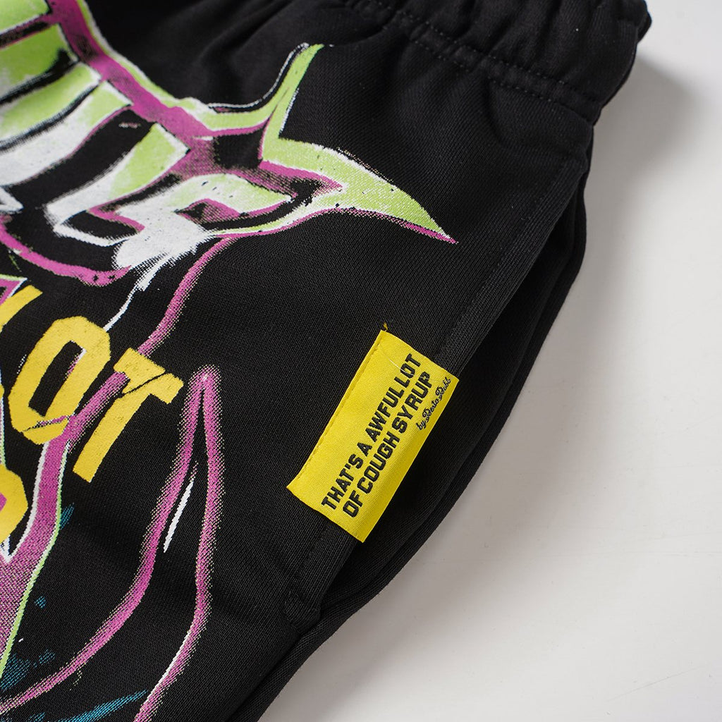 THAT'S A AWFUL LOT OF COUGH SYRUP Black Graphic Drawstring Shorts — detail