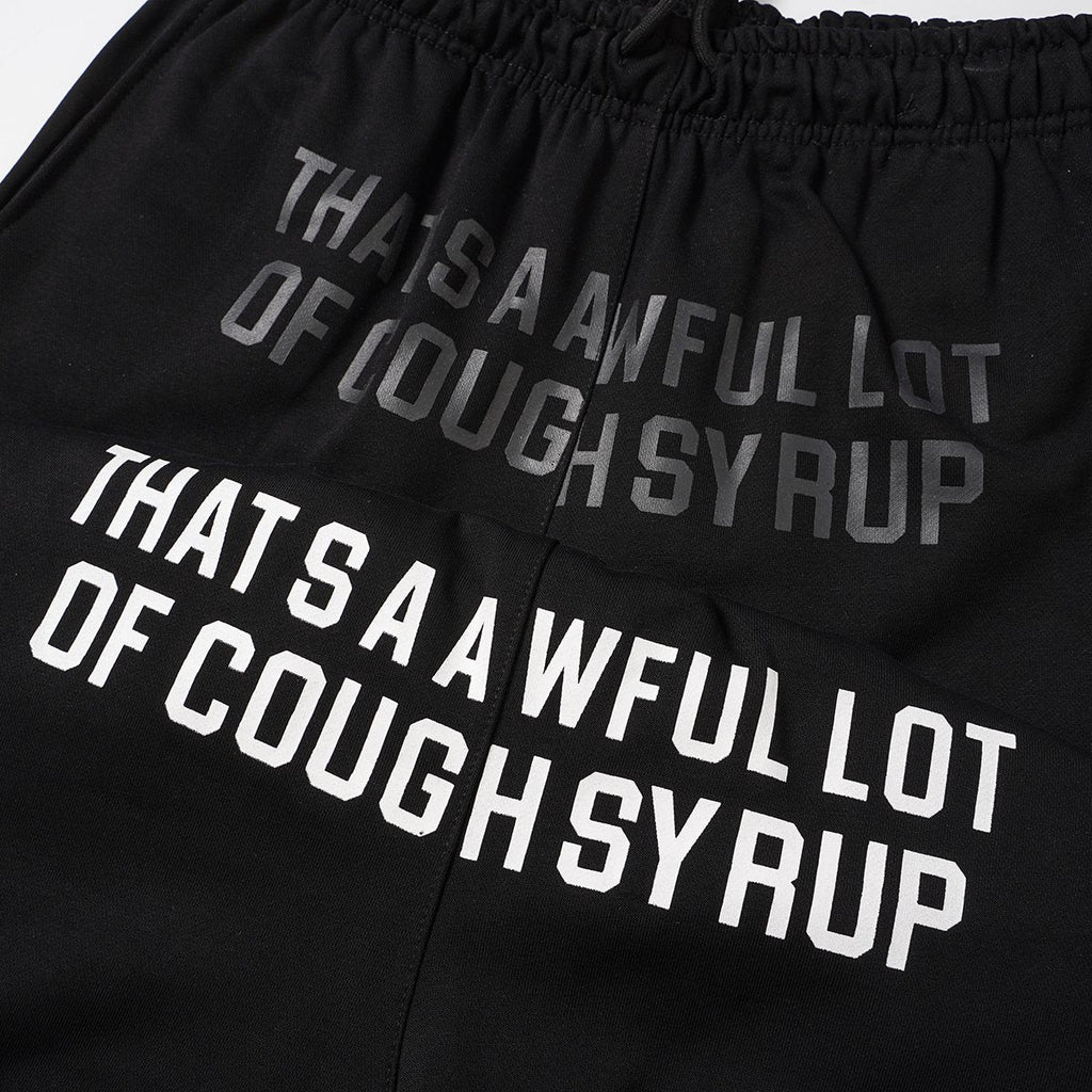 THAT'S A AWFUL LOT OF COUGH SYRUP Black Graphic Shorts — detail