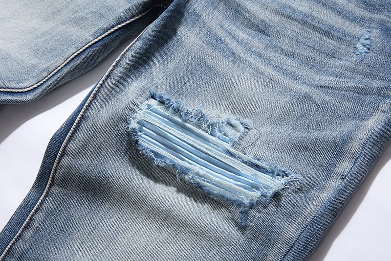 Amiri Light Blue Distressed Denim Jeans — detail