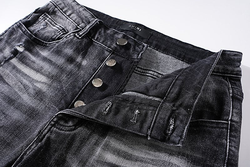 AMIRI Washed Black Distressed Jeans — detail