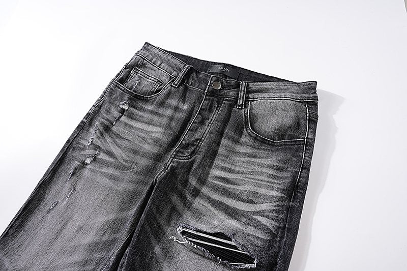 AMIRI Washed Black Distressed Jeans — detail