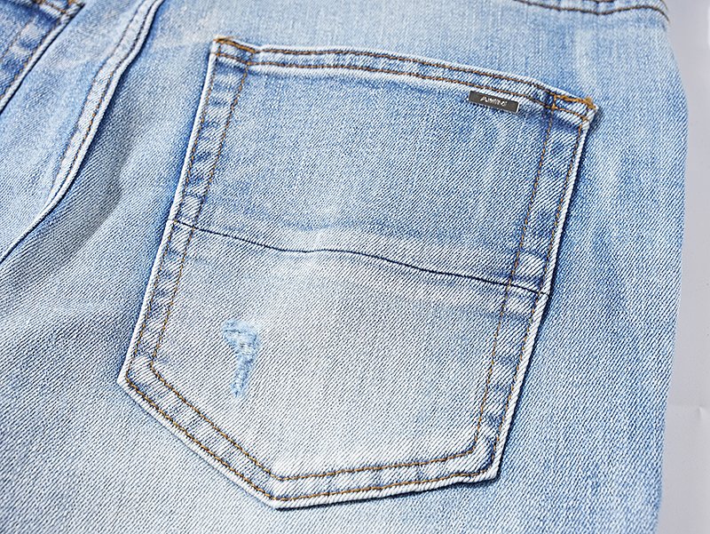 AMIRI Light Blue Distressed Paneled Jeans — detail