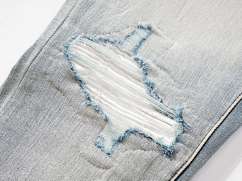 AMIRI Light Blue Distressed Ripped Knee Jeans — detail