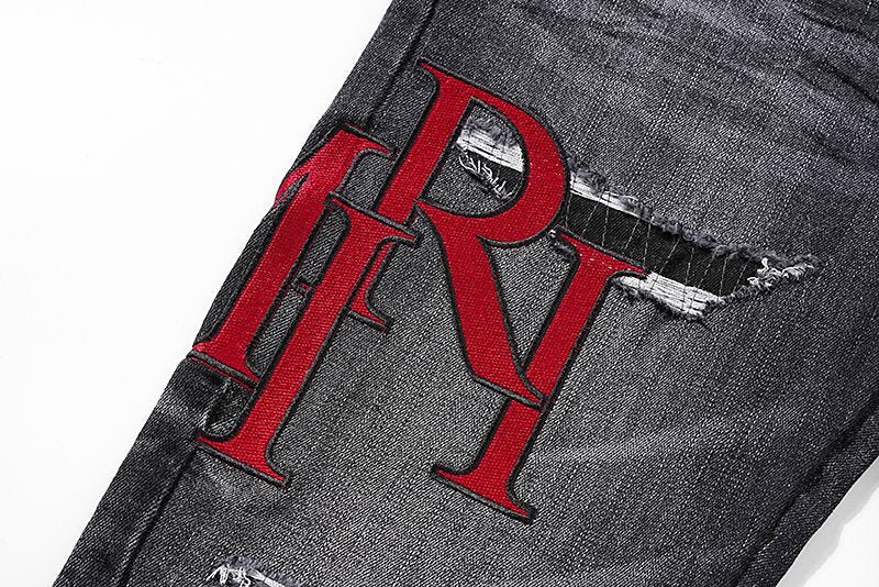 AMIRI Red Letter Graphic Washed Jeans — detail