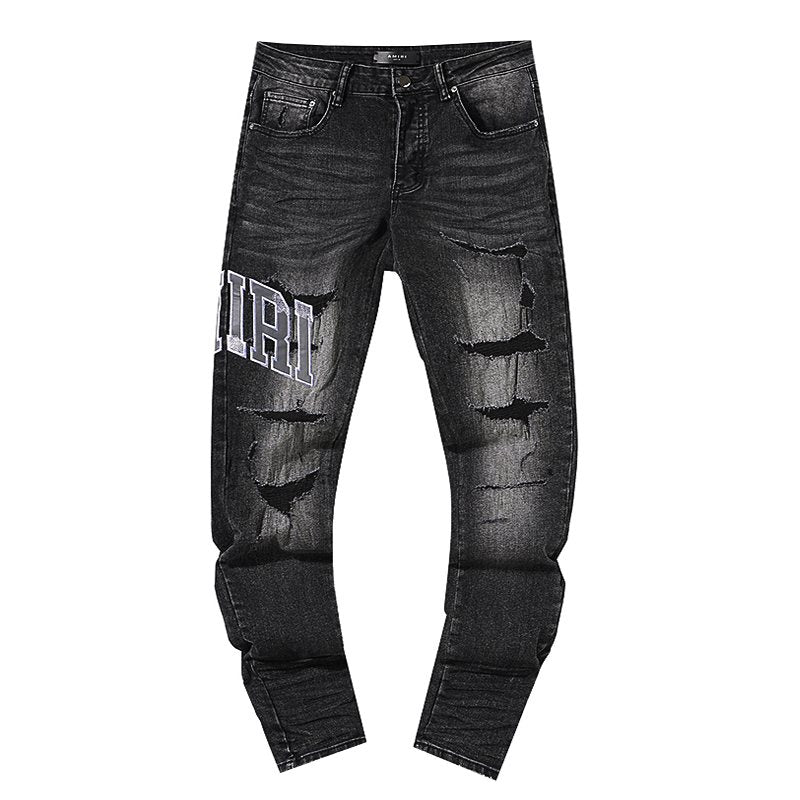 AMIRI Distressed Washed Black Graphic Jeans — hero