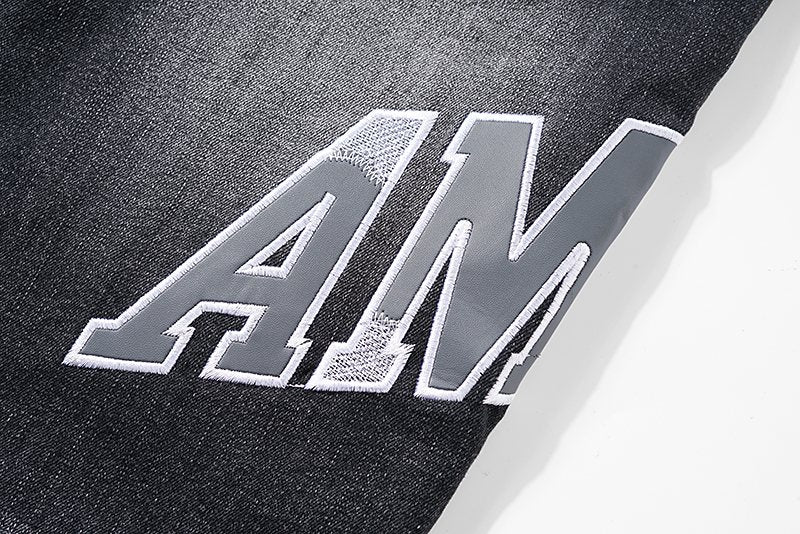 AMIRI Distressed Washed Black Graphic Jeans — detail