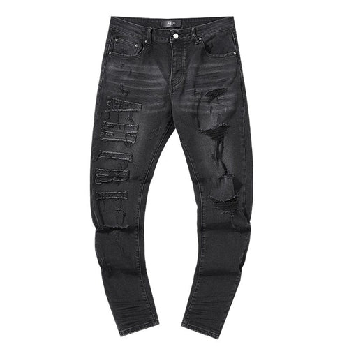 AMIRI Distressed Black Washed Jeans — front
