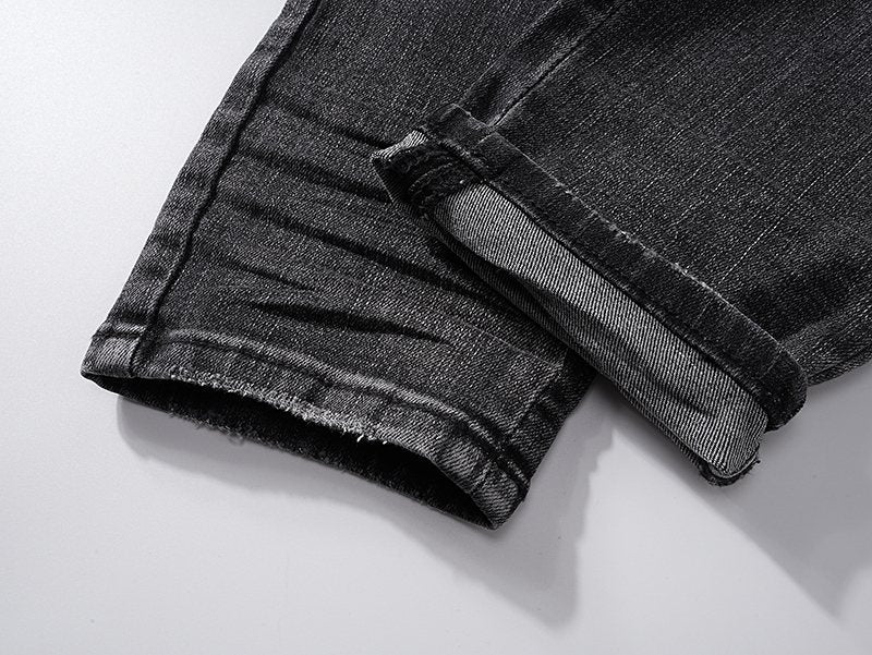 AMIRI Washed Black Embroidered Jeans — detail