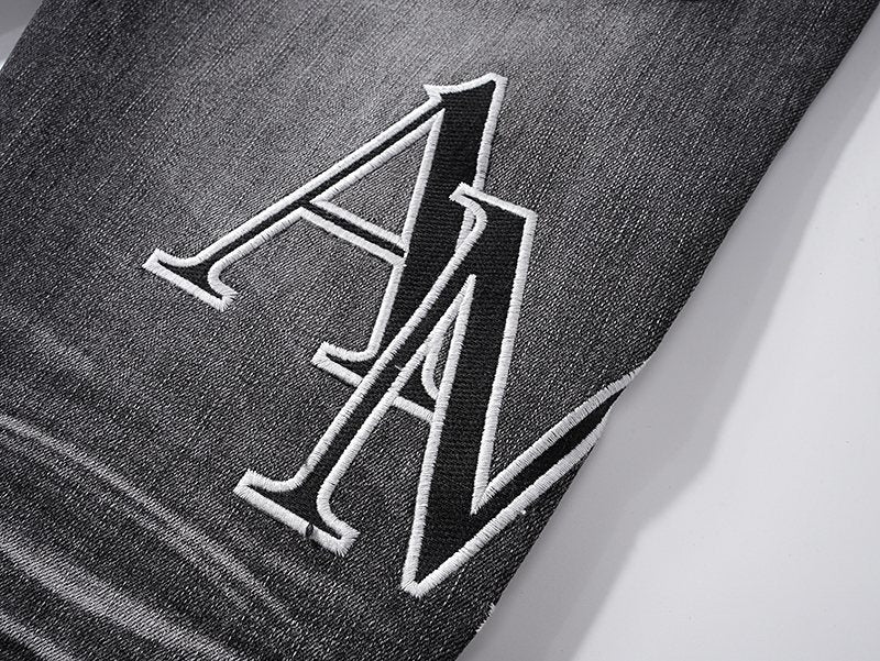 AMIRI Washed Black Embroidered Jeans — detail
