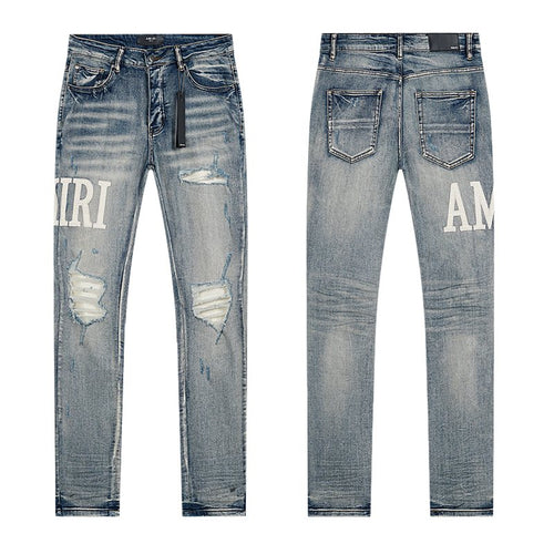 AMIRI Light Blue Distressed Letter Applique Jeans — hero