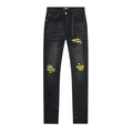 AMIRI Yellow-Backed Distressed Black Jeans — front