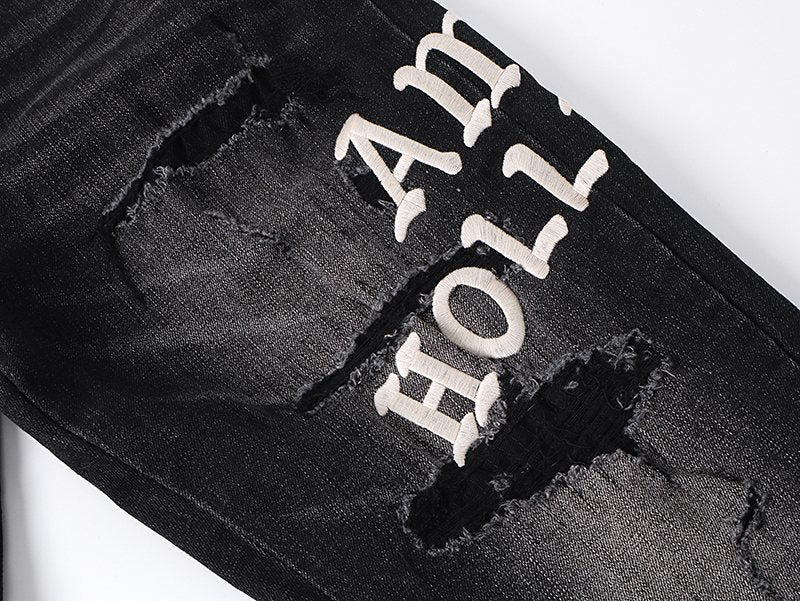 AMIRI Hollywood Lettering Distressed Jeans in Black — detail