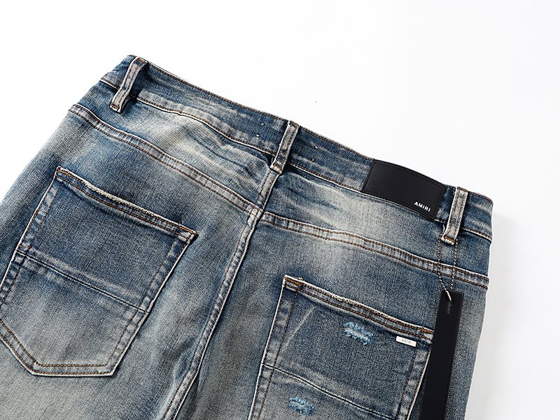 AMIRI Light Blue Distressed Appliqué Jeans — detail